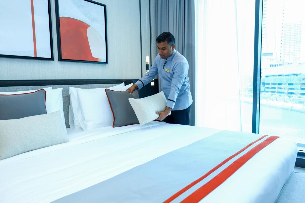 Отель Charthouse Bahrain Манама Экстерьер фото A hotel housekeeper making a bed